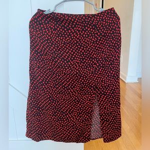Black midi skirt with red dots on it. Size M (EU 38, US 6).